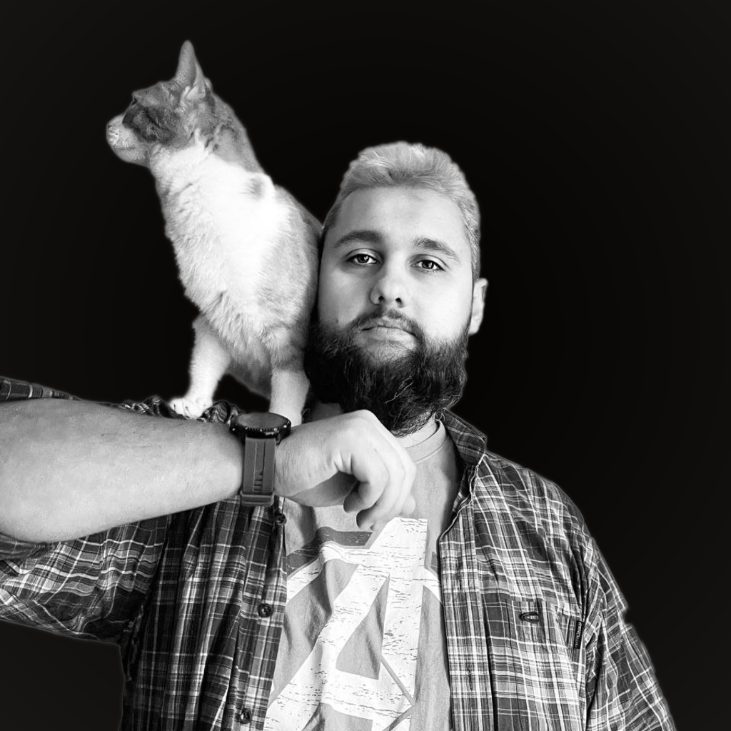 Image of Nikola Bangie Cvetkovic holding the cat on the shulder